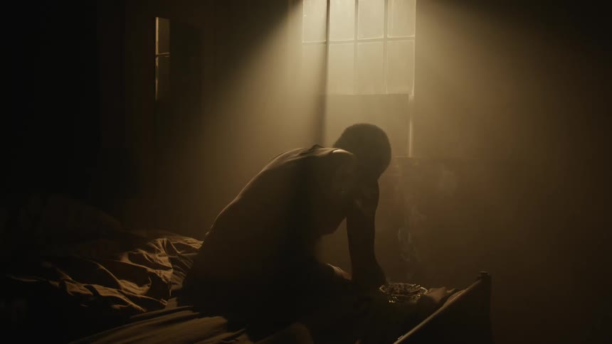 A man being sad in bed