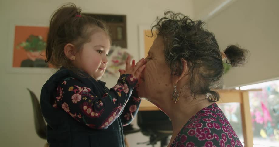 A granddaughter and grandmother hugging