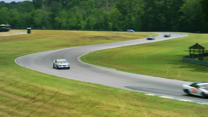 Cars racing around a race track