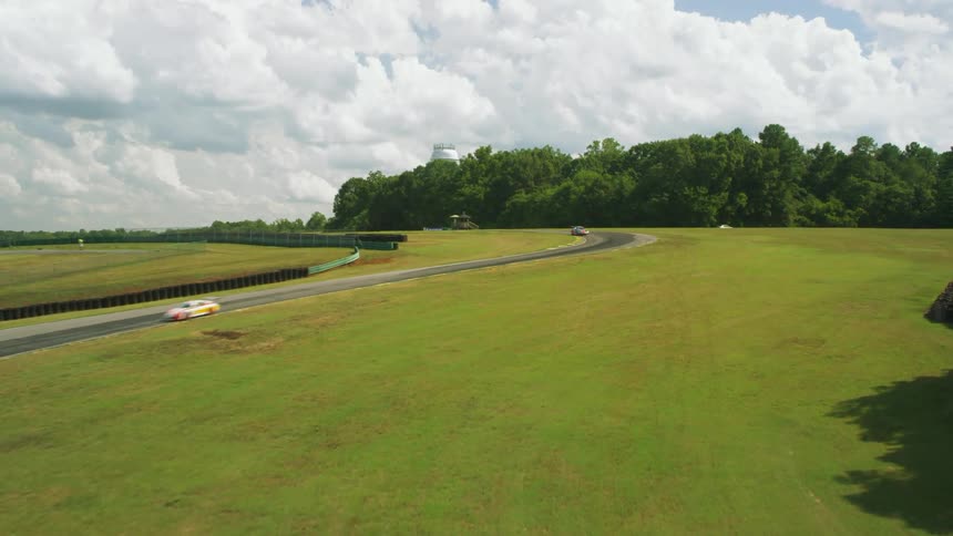 The race cars compete on the runway