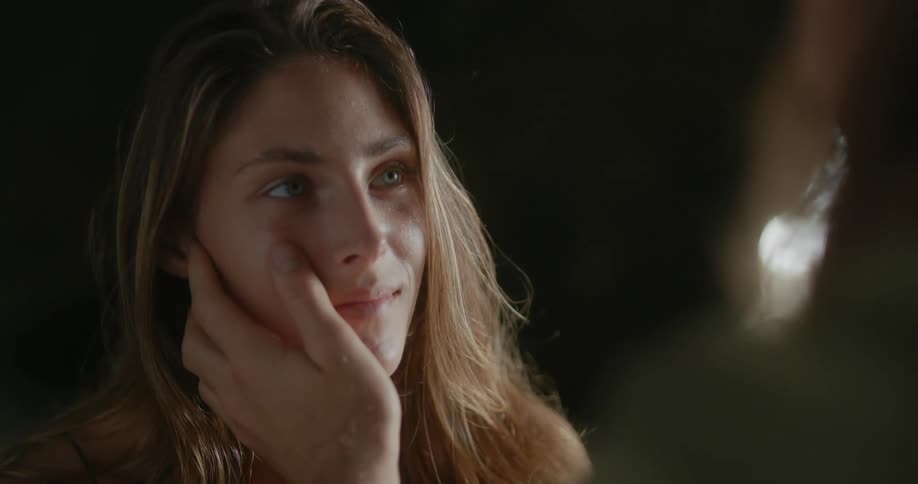 A boyfriend touching his girlfriends face