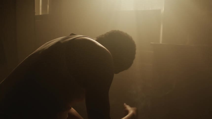 A man sitting in a room thinking
