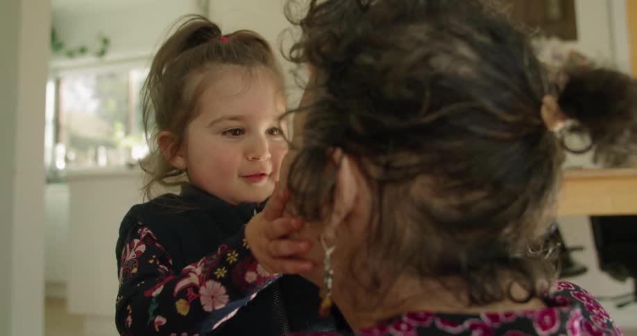 A child playing with her grandmother