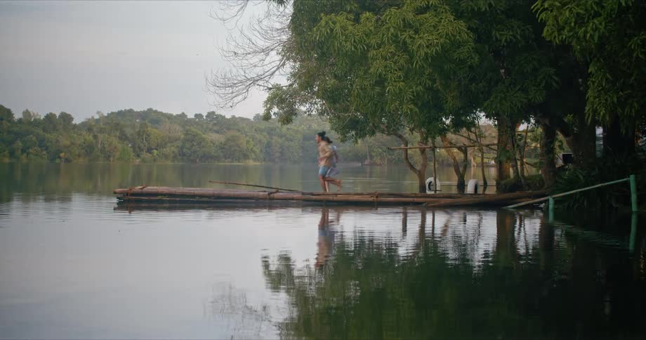 Two people run out on the pier