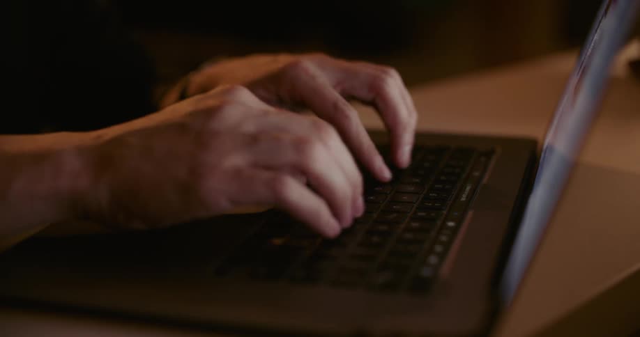 Person typing on laptop