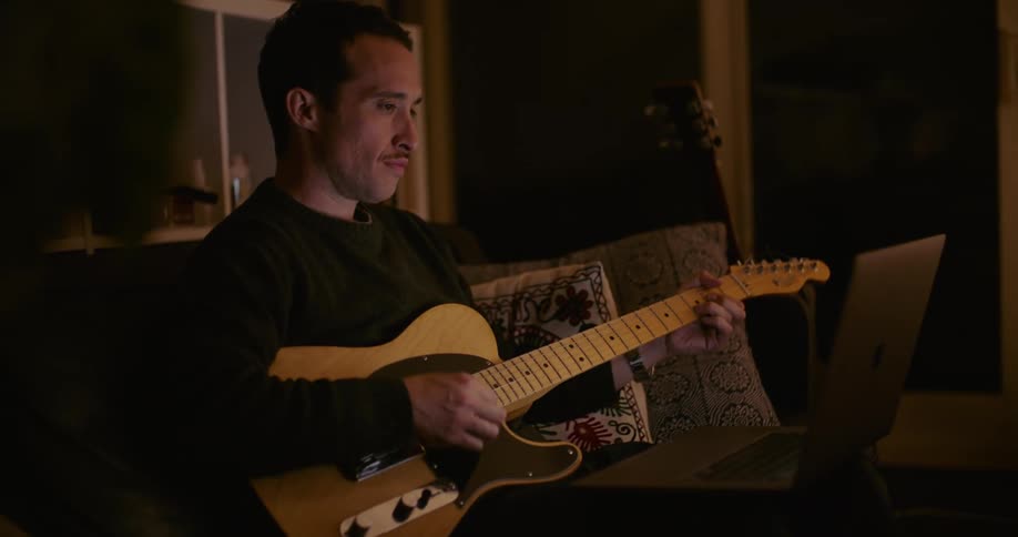 A man playing a guitar