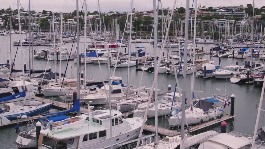 Boats moored in a marina during the day