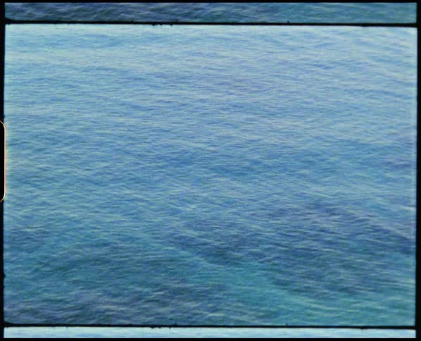 Footage of water moving in the ocean is displayed