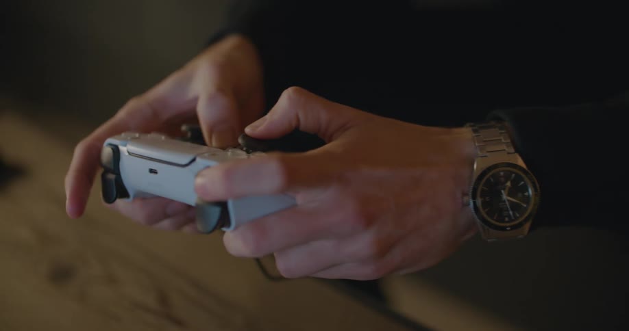 A close up of a person using a game controller