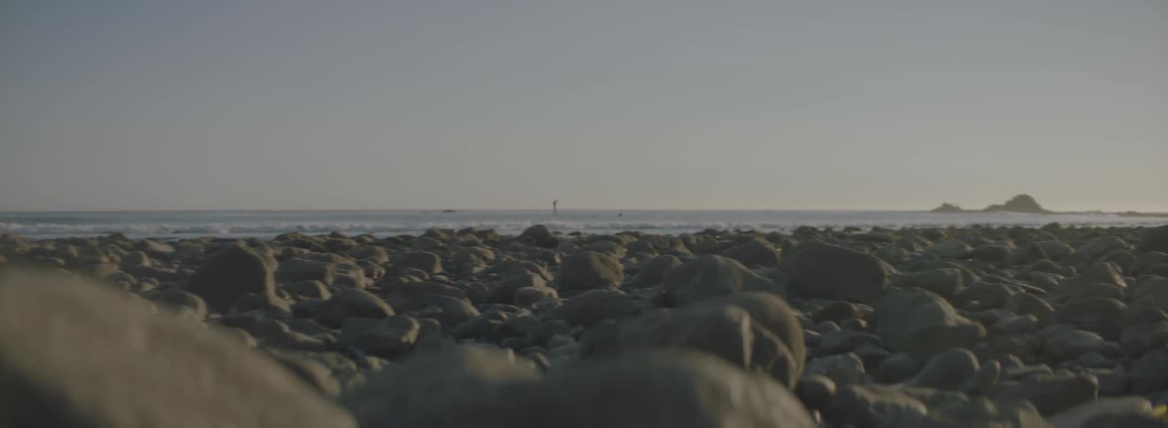 Ground level view of many rocks by the shore