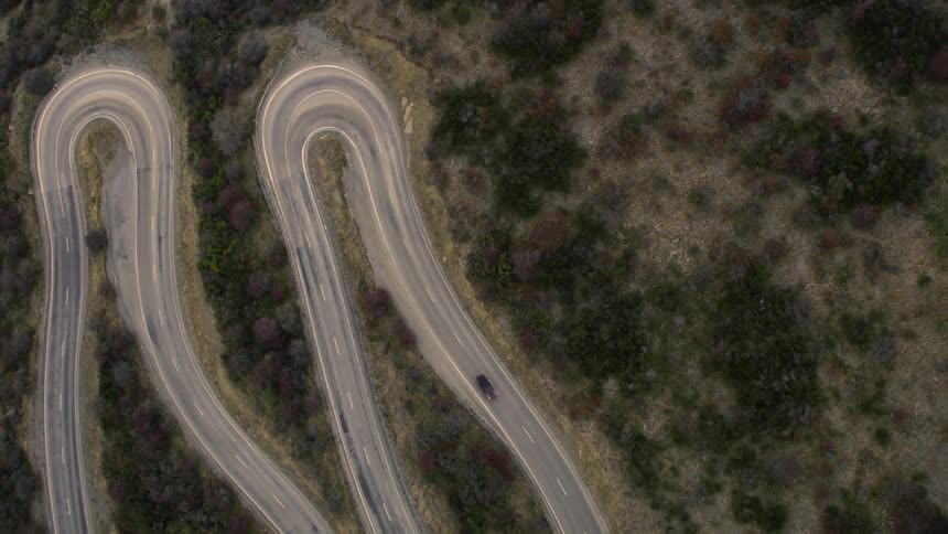 A car driving down a rural road
