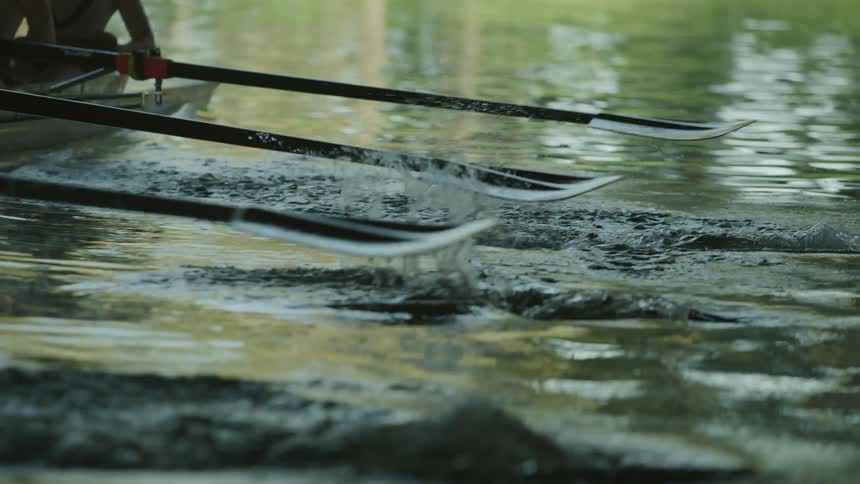 A person is paddling a boat on a river