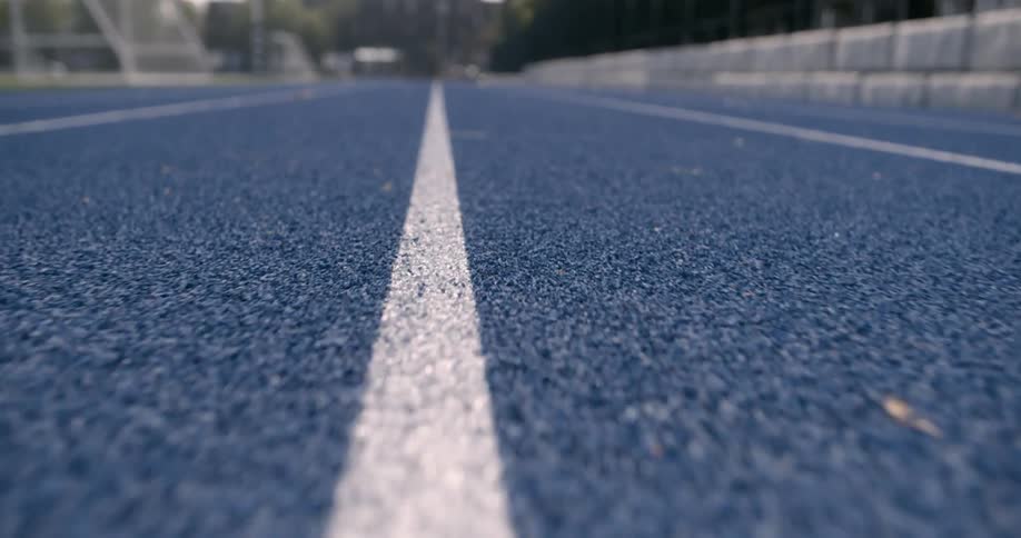 View of travelling along a lane line on an athletic track