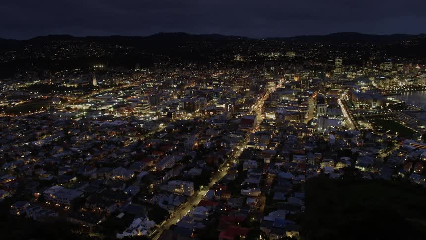 City buildings and streets shimmer at night