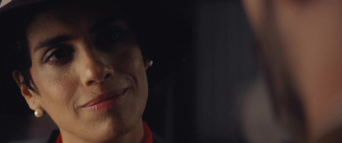 Woman and man look into each others face then smile at each other