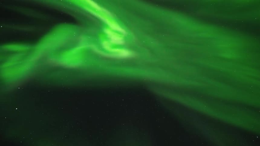 Northern lights corona flickering across the night sky