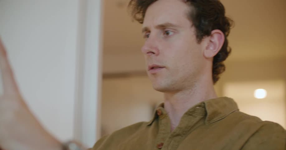 A man looking at a tablet