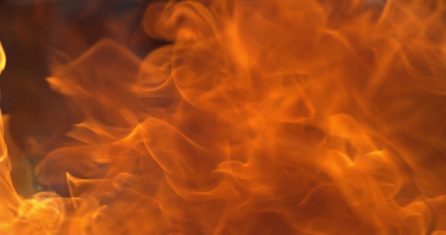 A view of fire burning in slow motion at night