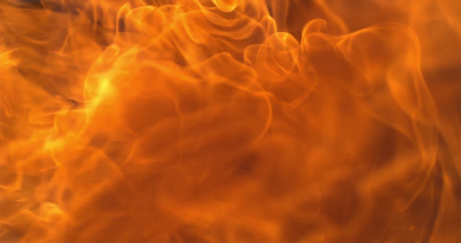 The camera captures a closeup of an actively burning fire