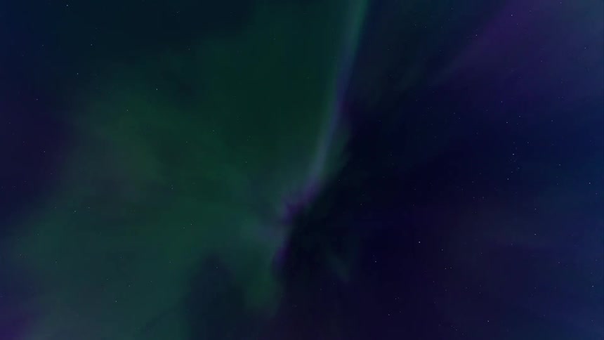 The purple and green aurora borealis corona flashes across the sky in timelapse