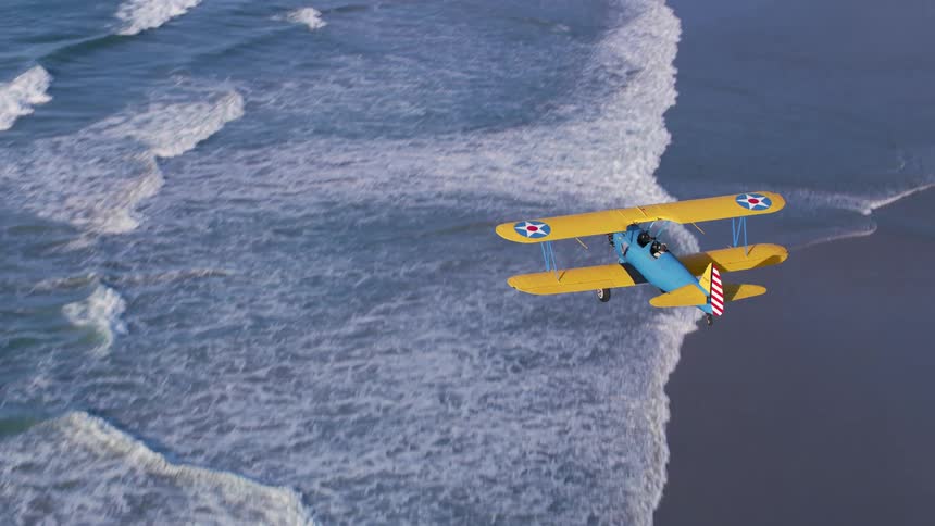A plane flies over the coast line