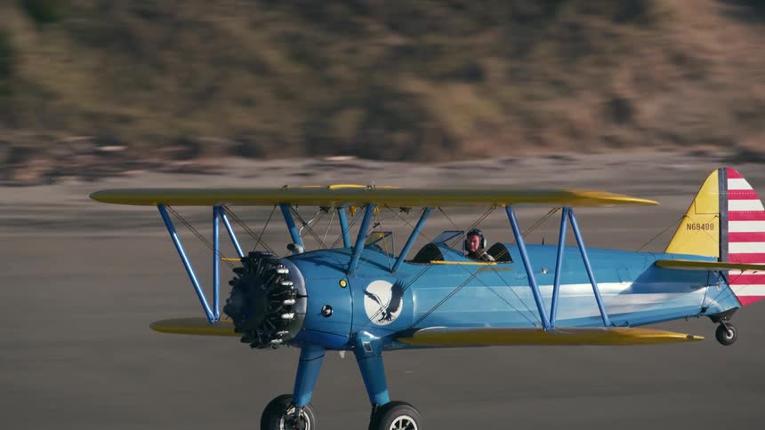 Airplane flying over a coast