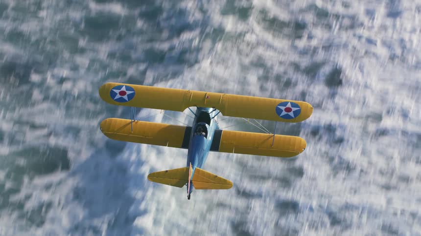 A person flies a small plane over the ocean