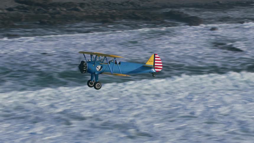 A view of a plane flying over a beach