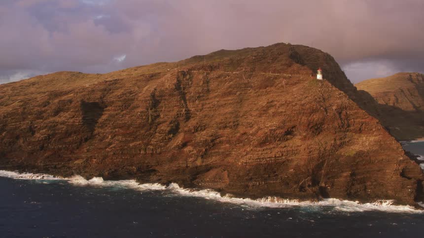 An aerial view of a mountain against the coast