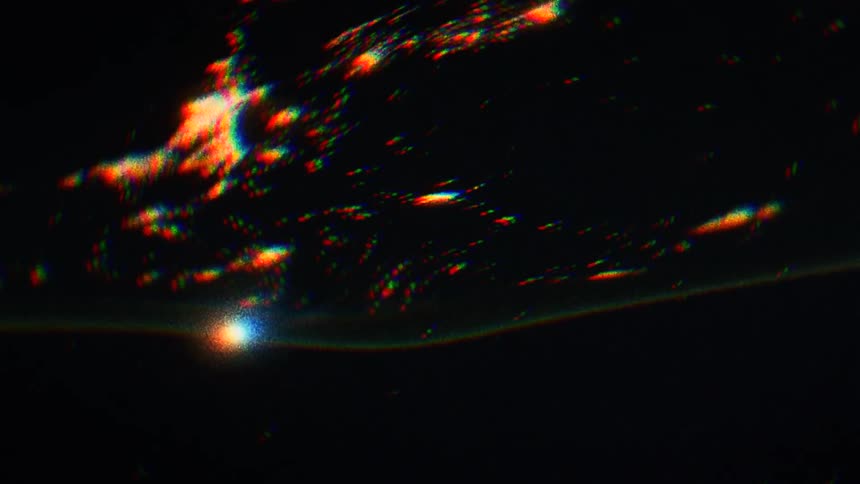 Black orange and white colors that look like oil water and light