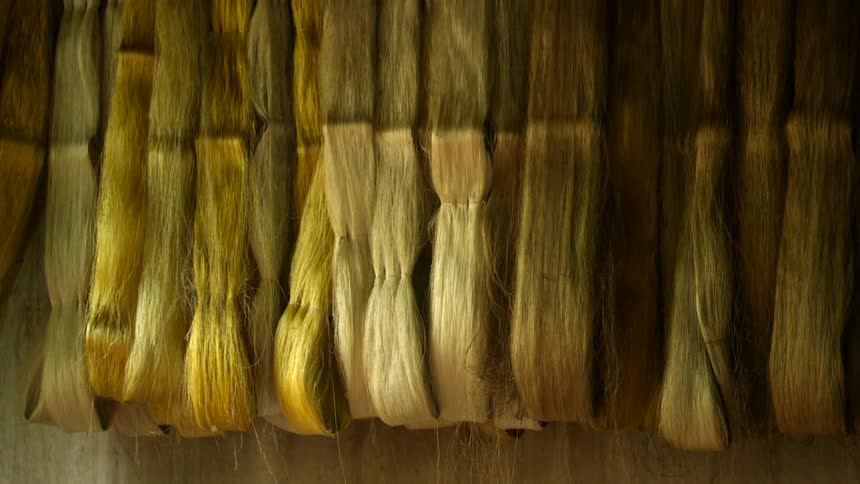 A close up of a yellow fabric