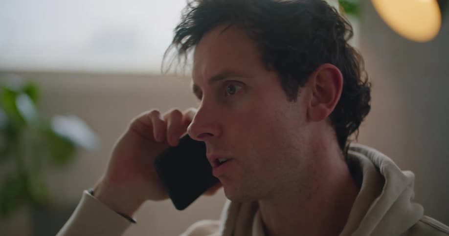 A man that is talking on a smartphone