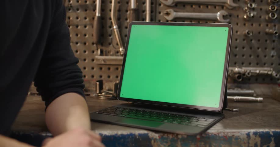 Person sitting beside laptop