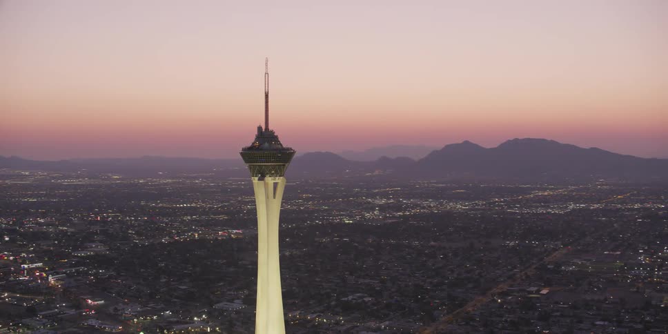 A tall tower is in the middle of the city
