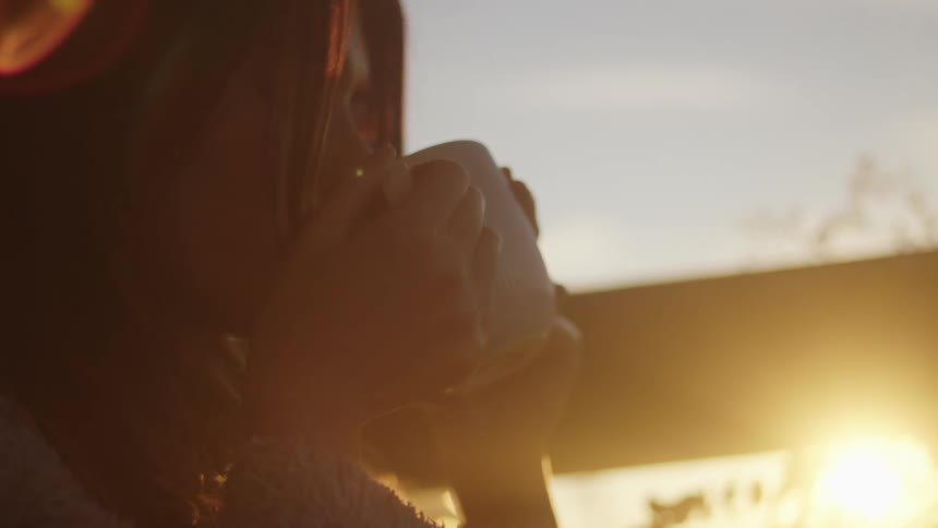 Woman drinking from a mug