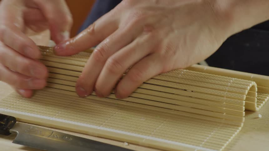 Person preparing sushi