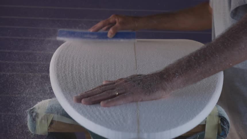 Person brushing wood