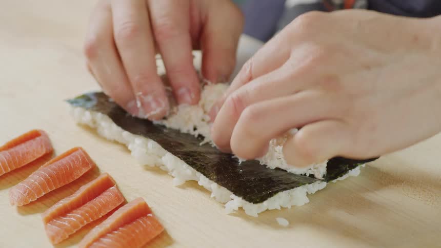 A person preparing sushi