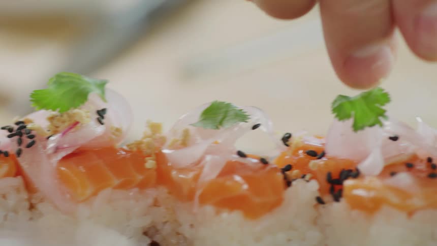 Person preparing sushi