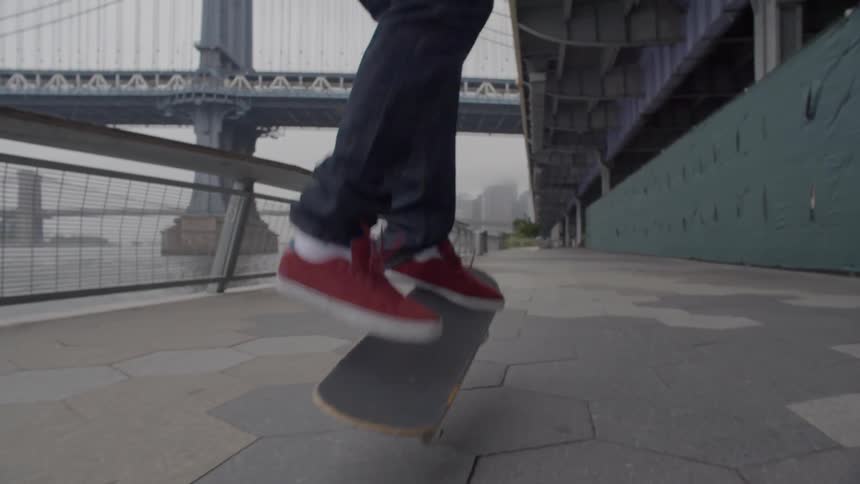 A person does a jump on a skateboard