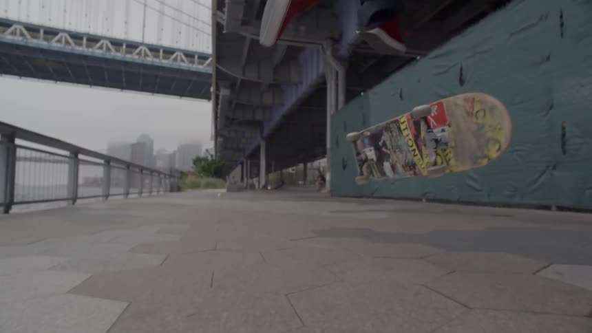 A man does a trick on a skateboard