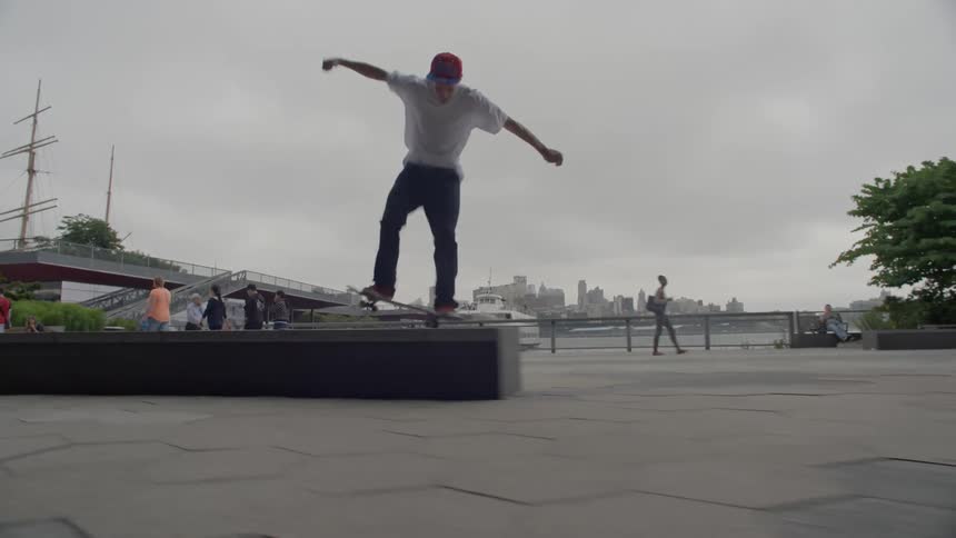 A man does some skateboard jumps
