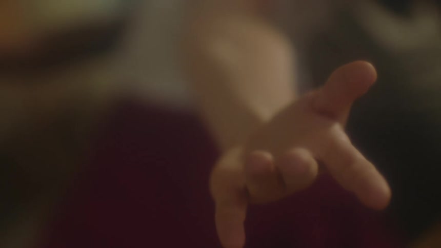 Person stretches hands out moving them down then upward
