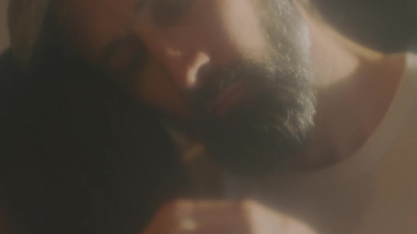 A man laying around in the middle of the day
