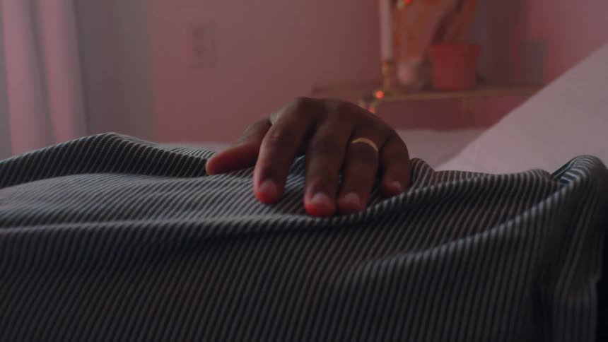 A person is laying in bed