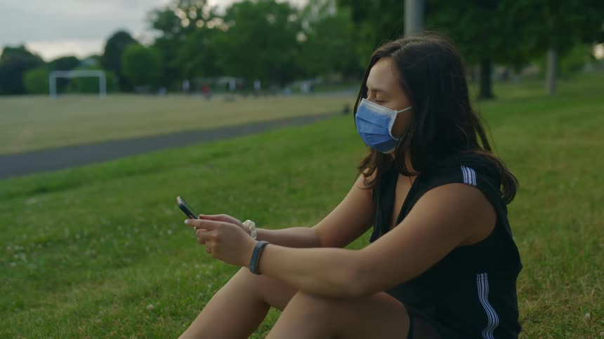 A woman using a smartphone outside