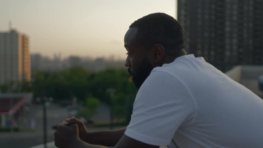 Black male leaning over