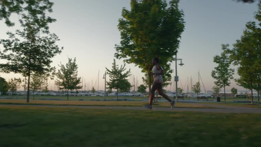 Woman jogging on a park at morning
