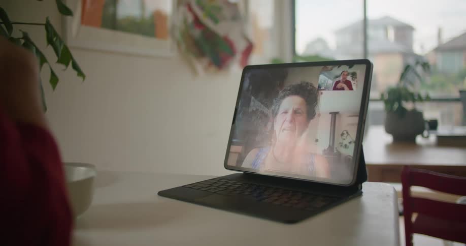 A person talking on a tablet