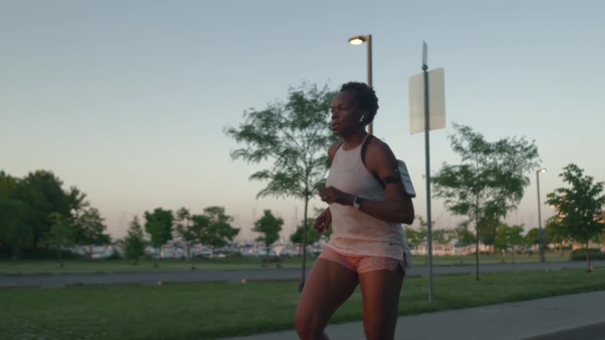 A woman running down a road
